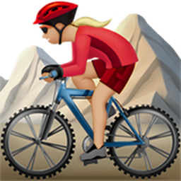 woman mountain biking: medium-light skin tone