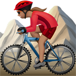 woman mountain biking: medium skin tone
